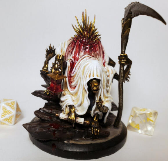 D&D figure of a sheet covered gold demon